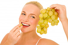 girl eating grapes